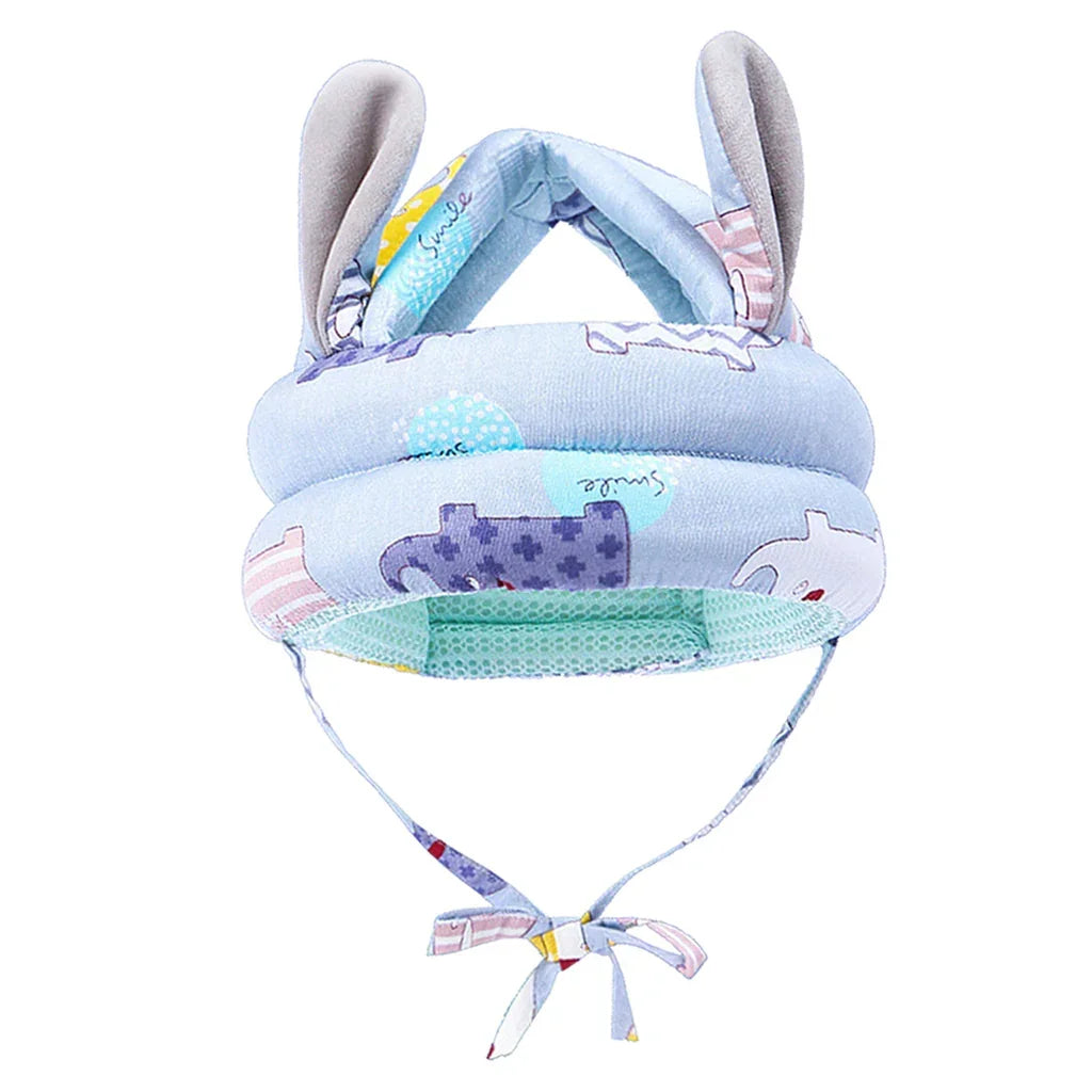 Light blue padded baby safety helmet with animal print, plush ears, and adjustable chin strap