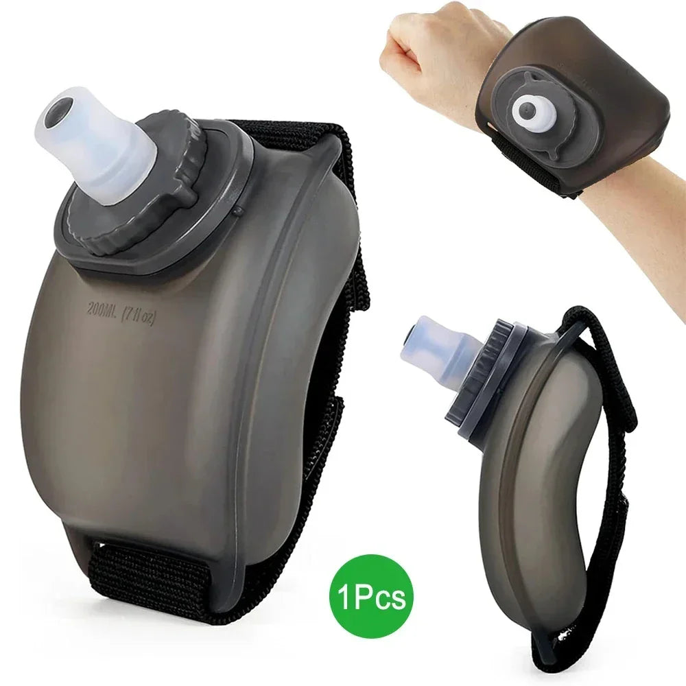 Black wrist water bottle with adjustable strap, translucent plastic, ergonomic fit.