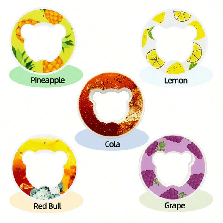 Five round bear-shaped drink covers in pineapple, lemon, cola, red bull, and grape designs.