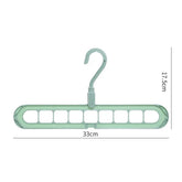 Green plastic multi-slot clothes hanger, 33cm wide, 17.5cm tall, for space-saving closet storage.