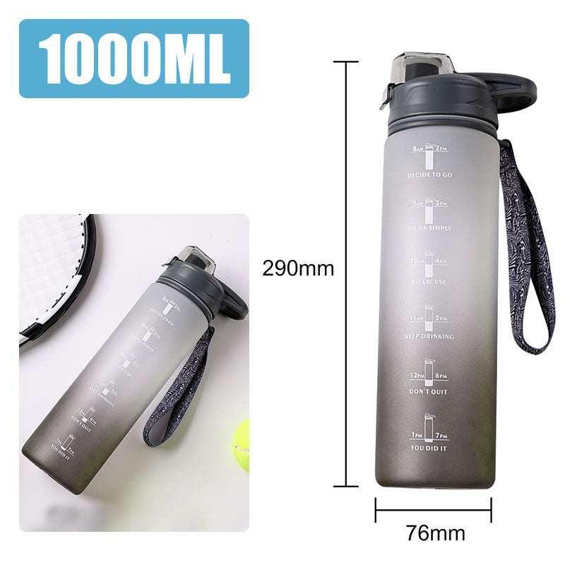 Large 1000ml gray plastic water bottle with time markers and a patterned carrying strap.