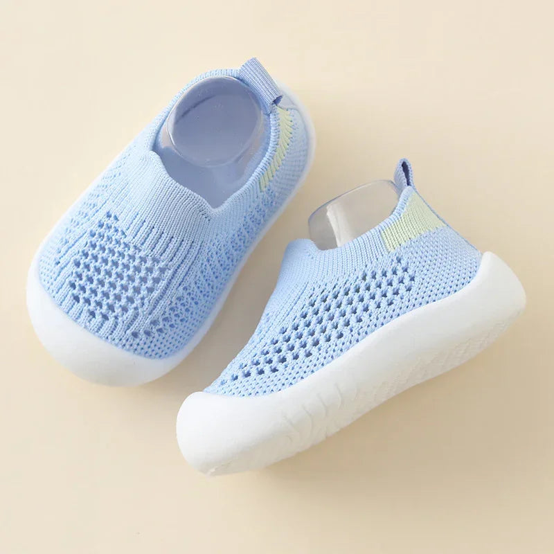 Light blue knit slip-on baby shoes with white soles, breathable mesh material, casual fit