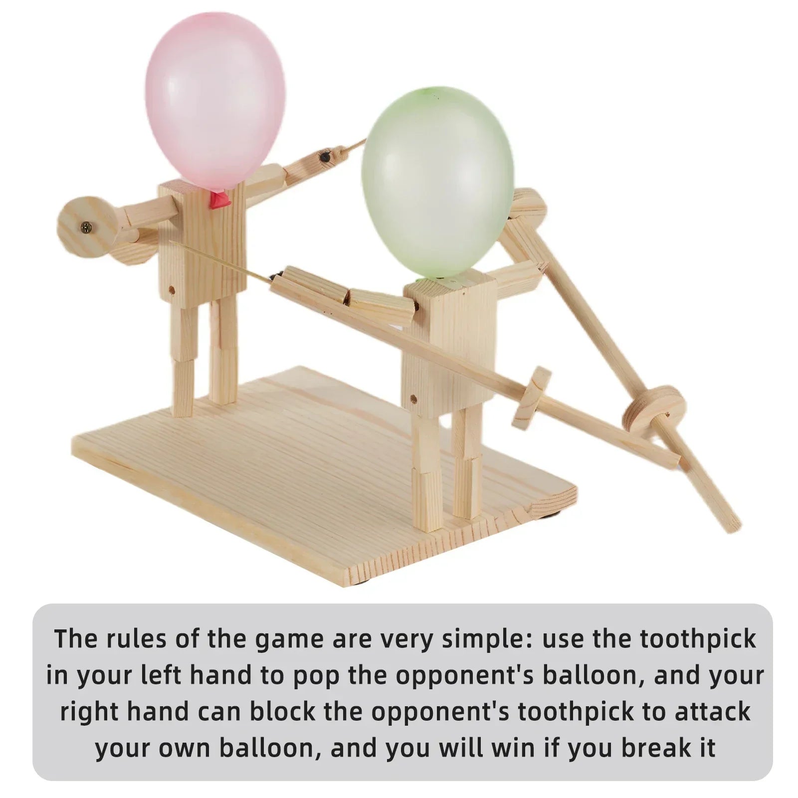Wooden tabletop toy game with two figures holding toothpicks, each with a balloon head, ready for balloon popping competition.