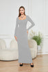 Woman wearing a fitted light gray long sleeve maxi dress with square neckline