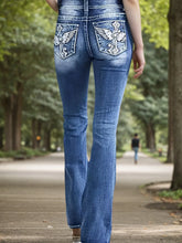 Blue flared jeans with embroidered back pockets, denim streetwear, relaxed outdoor fit