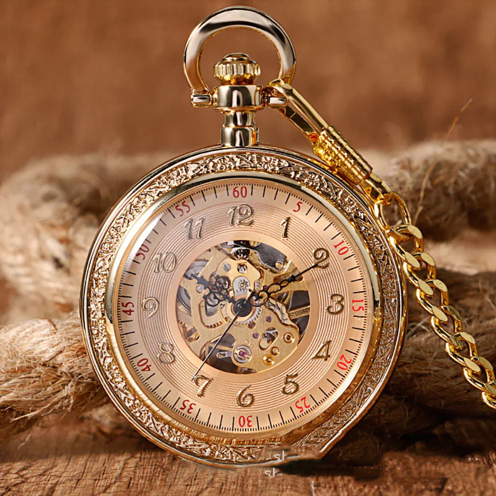 Gold vintage pocket watch with engraved edges and visible mechanical movement