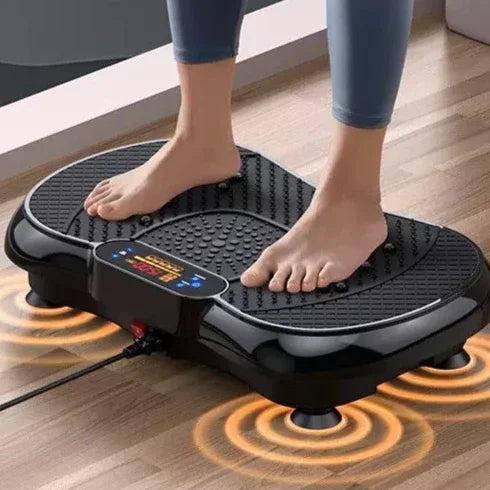 Person standing on a black vibrating foot massage platform with digital controls, wearing fitted leggings.
