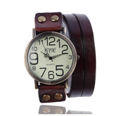 Vintage brown leather wrap watch with round face and large numbers, adjustable metal studs.