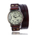 Vintage brown leather wrap watch with round face and large numbers, adjustable metal studs.