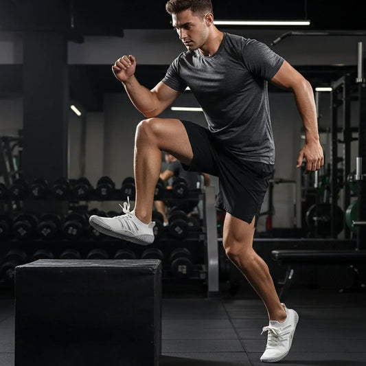 Man in athletic fit, moisture-wicking dark gray t-shirt and black shorts training in gym