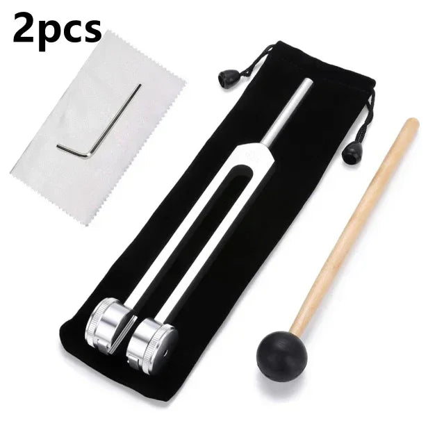 Silver tuning fork set with mallet, hex key, cleaning cloth, and black pouch