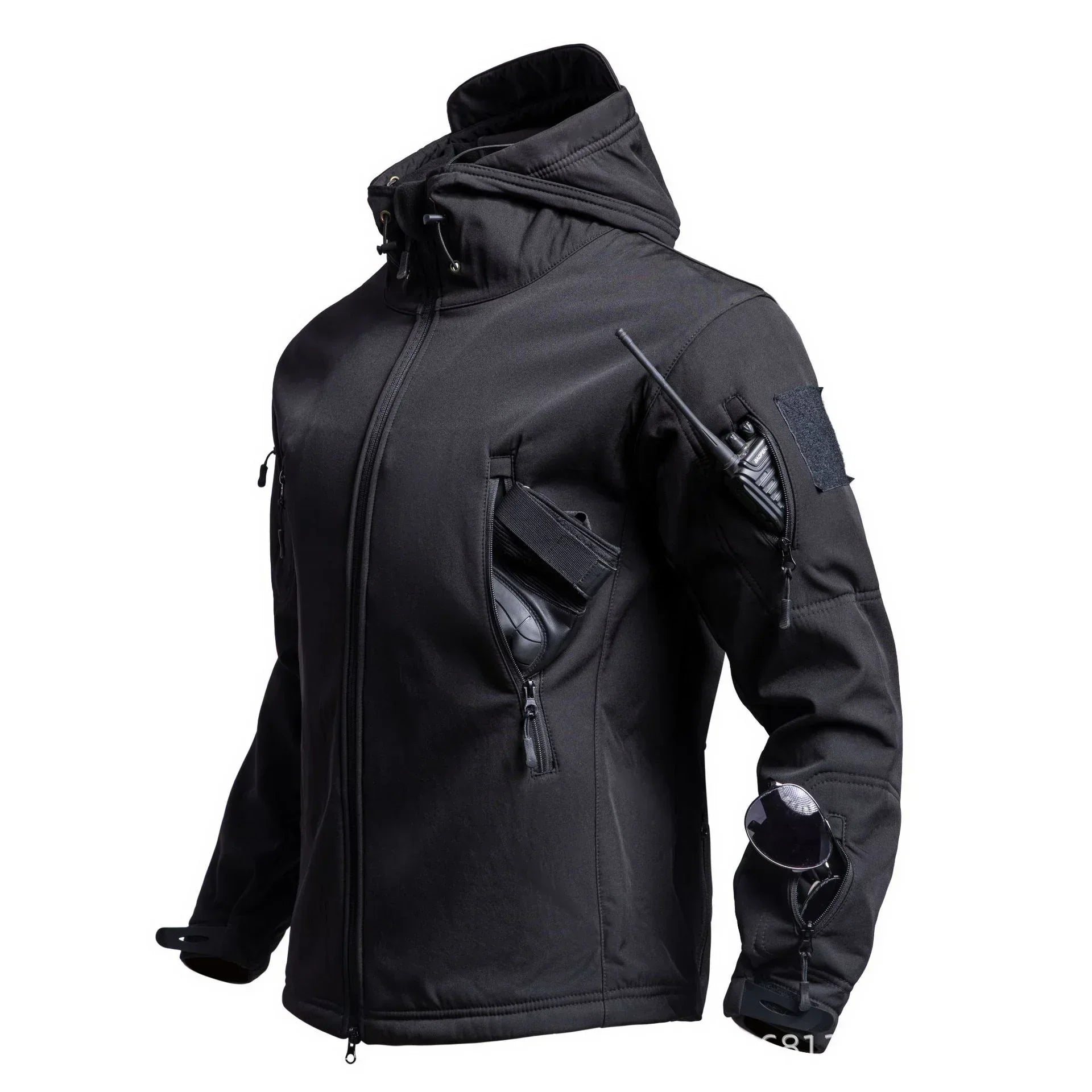 Black tactical softshell jacket with multiple zippered pockets and hood, modern streetwear style