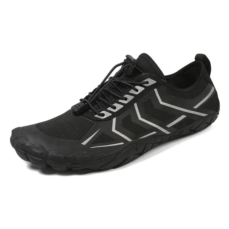 Black minimalist sneaker with reflective silver accents, mesh material, and slim fit design