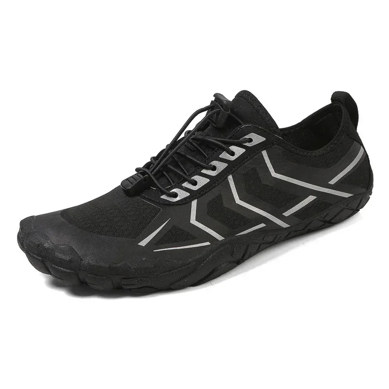 Black minimalist sneaker with reflective silver accents, mesh material, and slim fit design