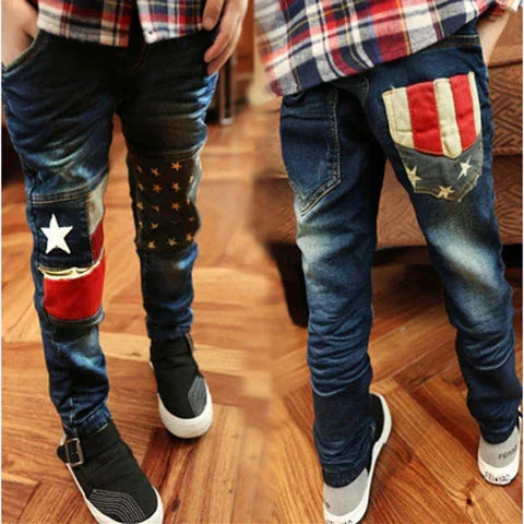 Kid wearing slim-fit denim jeans with flag patchwork, paired with checkered shirt and sneakers