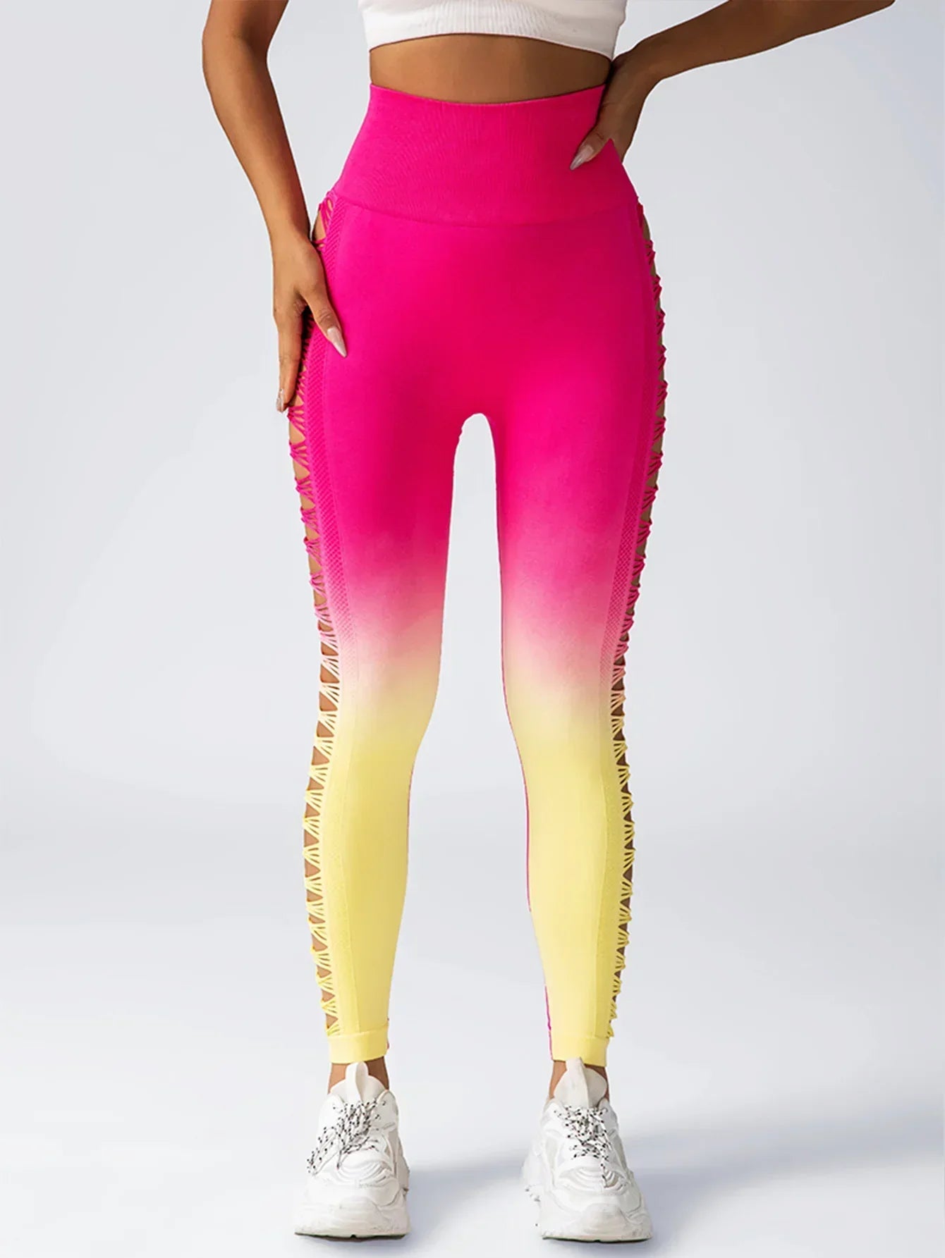 Pink and yellow ombre high-waisted leggings with side cut-out mesh details, slim fit.