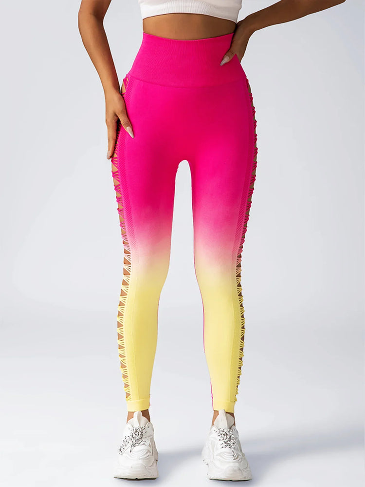 Pink and yellow ombre high-waisted leggings with side cut-out mesh details, slim fit.