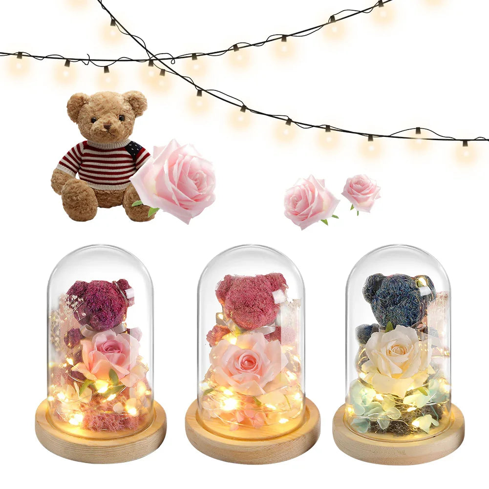 Plush teddy bear in striped sweater, glass dome lights with roses and bears, fairy string lights
