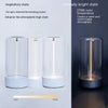 Modern cylindrical glass LED table lamp with white base, warm adjustable lighting, minimalist design.