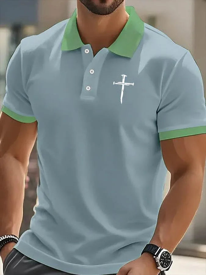 Light blue slim fit polo shirt with green collar and cuffs, cross graphic on chest