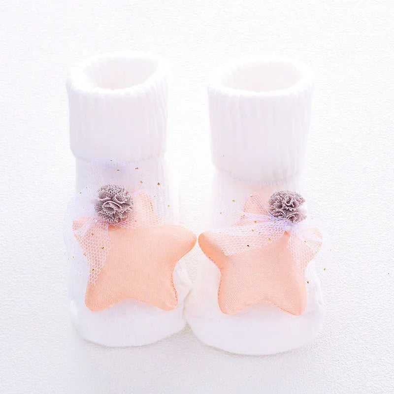 White ribbed baby socks with soft peach star decorations and delicate tulle accents