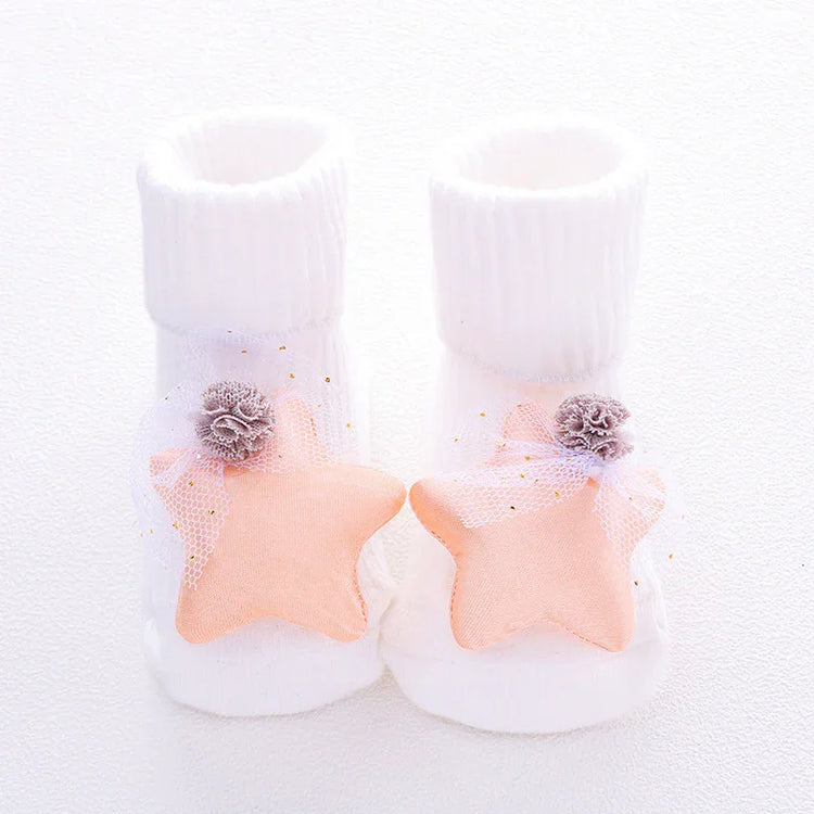White ribbed baby socks with soft peach star decorations and delicate tulle accents