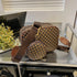 Brown geometric patterned crossbody bag with matching round coin pouch and adjustable strap