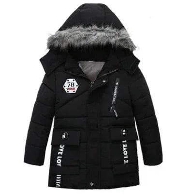 Black puffer jacket with faux fur hood, graphic patches, and relaxed streetwear fit