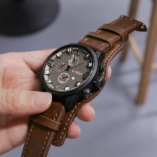 Modern black dial watch with large numerals and brown leather strap, casual streetwear accessory