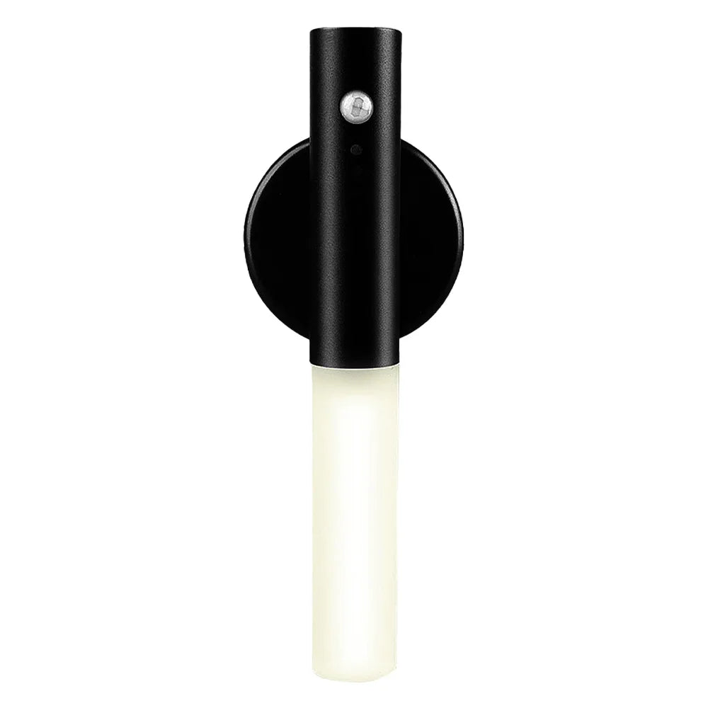 Modern black wall sconce with cylindrical LED light and matte finish.
