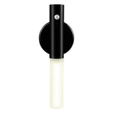 Modern black wall sconce with cylindrical LED light and matte finish.