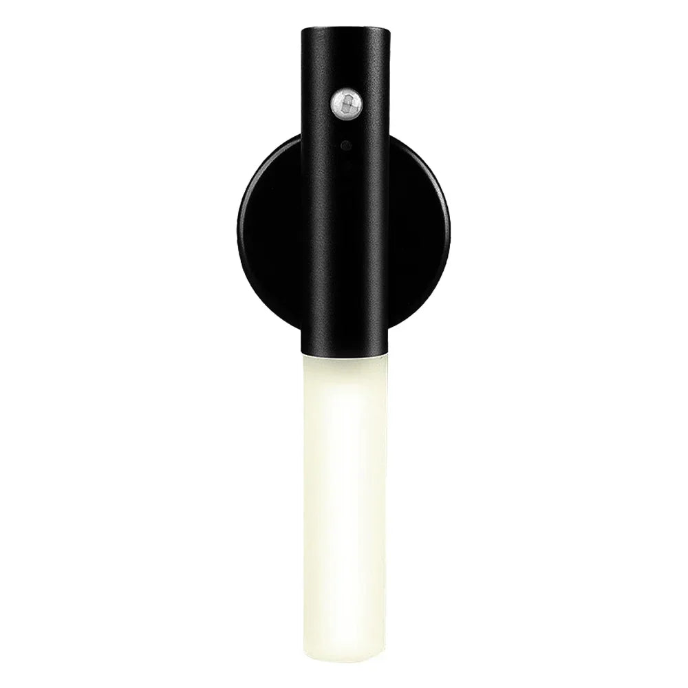 Modern black wall sconce with cylindrical LED light and matte finish.