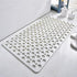 White non-slip bathroom mat with circular holes on tile floor, modern minimalist design