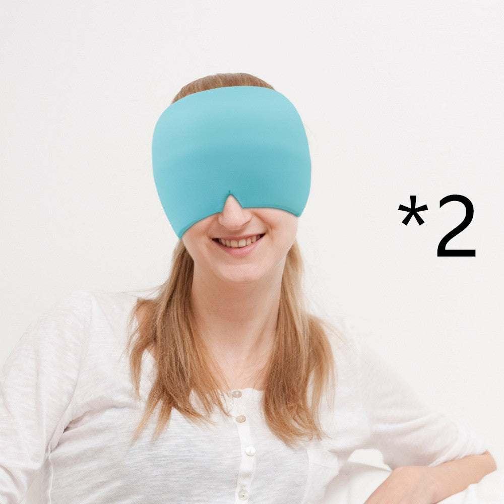 Woman wearing a turquoise oversized sleep eye mask with soft fabric, relaxed fit, indoors, two pack.