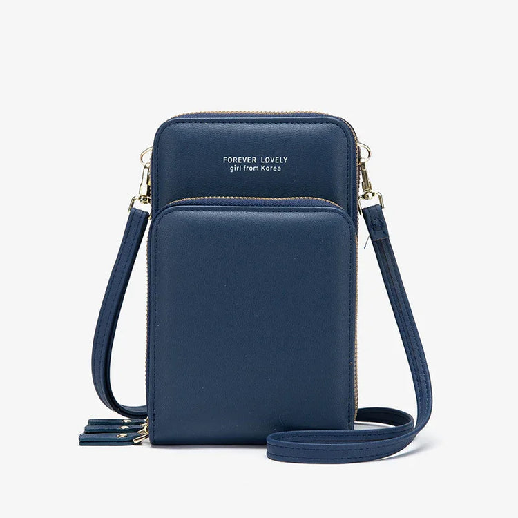 Navy blue crossbody bag with smooth leather texture, gold zippers, and adjustable strap