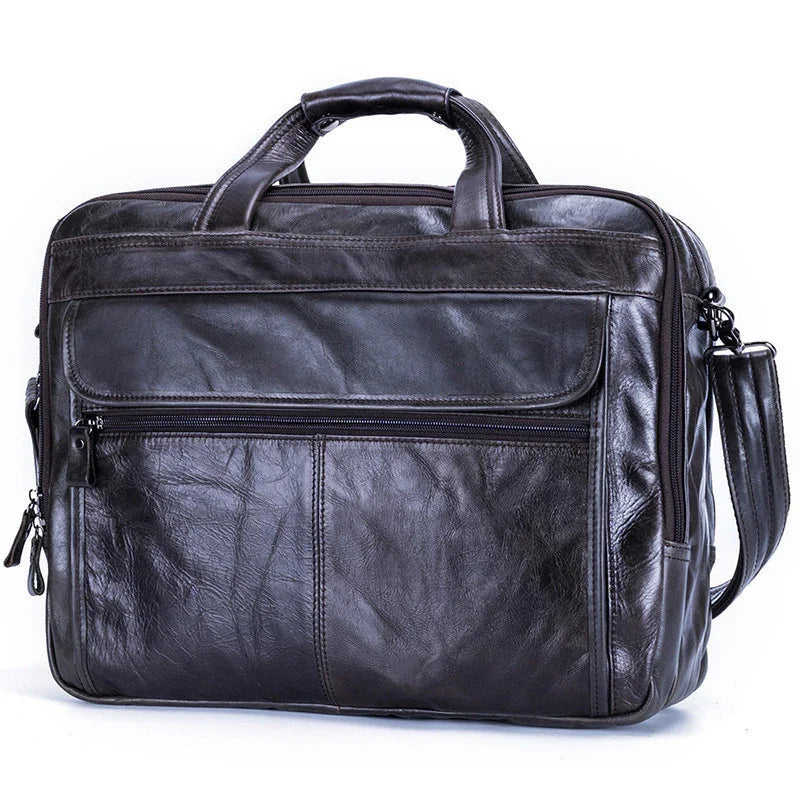 Black leather messenger bag with top handles, front zipper pocket, and shoulder strap