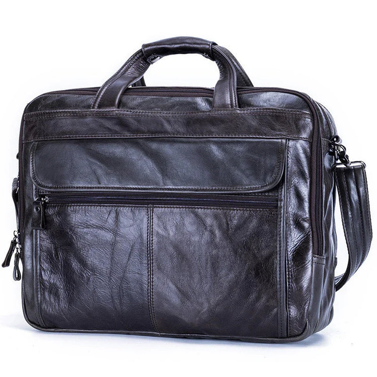 Black leather messenger bag with top handles, front zipper pocket, and shoulder strap