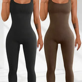 Two women wearing ribbed, sleeveless, fitted jumpsuits in black and brown, seamless design.