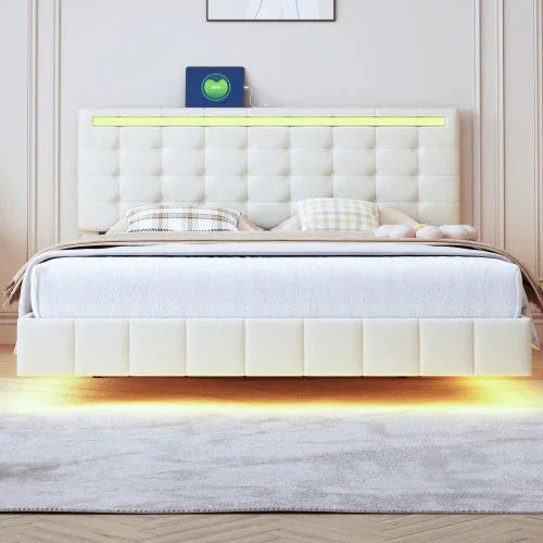 Modern white upholstered bed with tufted headboard, LED lighting, and soft bedding.