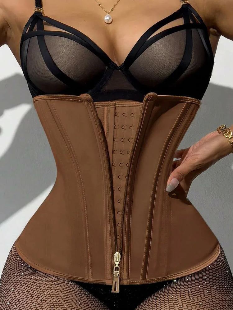 Woman wearing brown waist trainer corset with hook and zip closure, paired with sheer black lingerie and fishnet tights