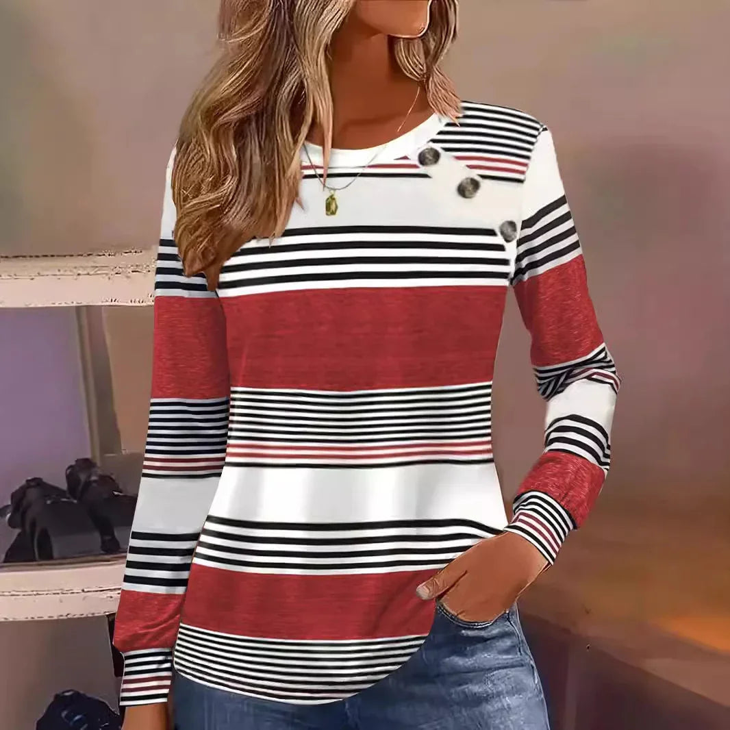 Woman wearing a red, white, and black striped long sleeve knit top with button accents, relaxed fit