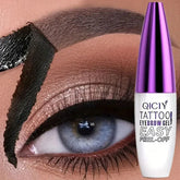 Close-up of eyebrow with black peel-off eyebrow gel applied, next to eyebrow gel bottle
