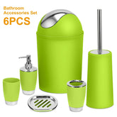 Green bathroom accessories set with metallic accents, includes bin, soap dispenser, toothbrush holder, cup, soap dish, toilet brush