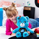 Child playing with 14-inch blue Rock-a-Lot Grumpy Bear plush featuring musical belly badge and lightning paw prints