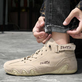 Beige suede high-top sneakers with lace-up front, chunky sole, and relaxed streetwear fit.