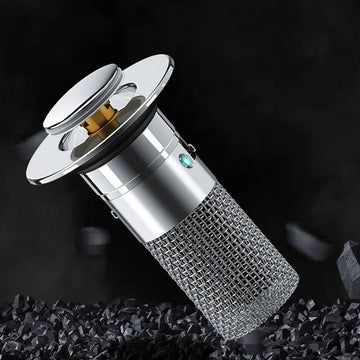 Futuristic silver metal drain filter with mesh body and pop-up top on black background