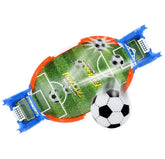 Mini tabletop soccer game set with green field, blue goals, and small soccer balls in action.