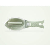 Fish-shaped kitchen tool with light green plastic handle and clear body, shown on white background.