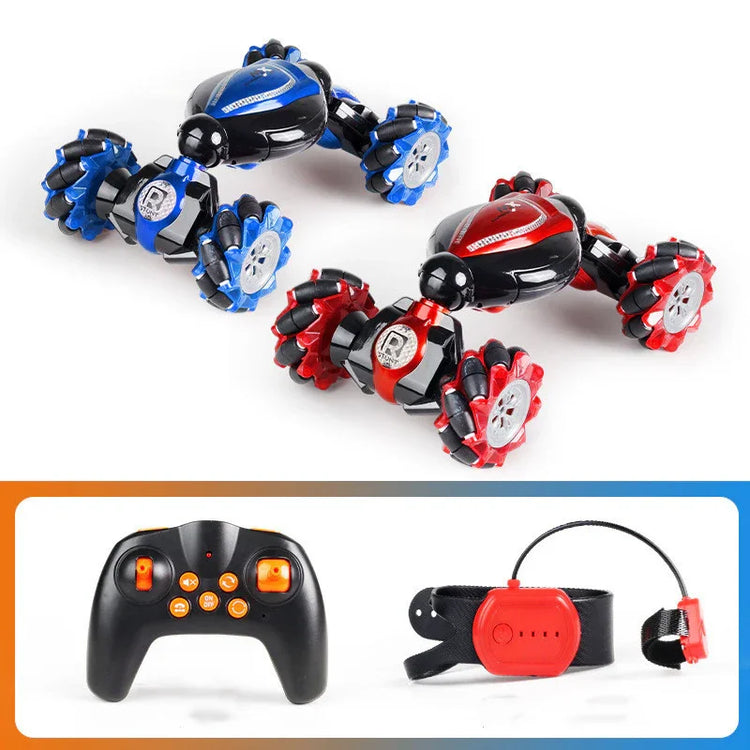 Two futuristic remote control stunt cars, one blue and black, one red and black, with multi-directional wheels, shown with a handheld controller and a wearable remote.