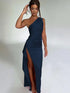 Woman wearing a navy blue one-shoulder evening gown with a thigh-high slit and fitted silhouette